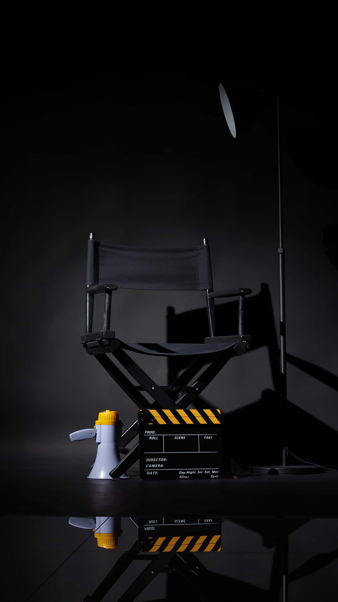 Empty Movie TV Directors Chair can be seen with a megaphone representing a open media job